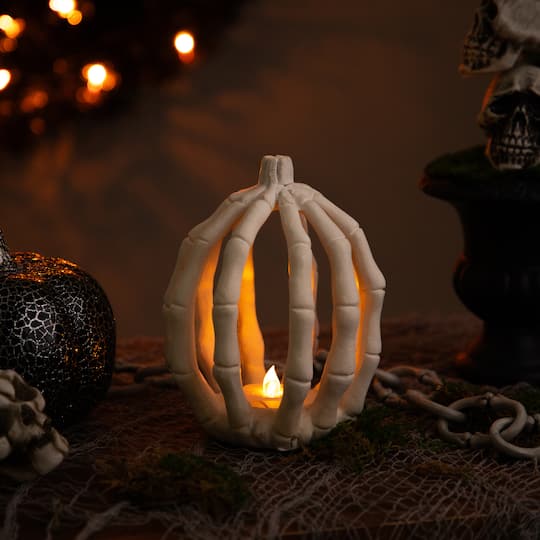 35246849 6.25 in. Battery Operated LED Lighted Skeleton Pumpkin Halloween Decoration